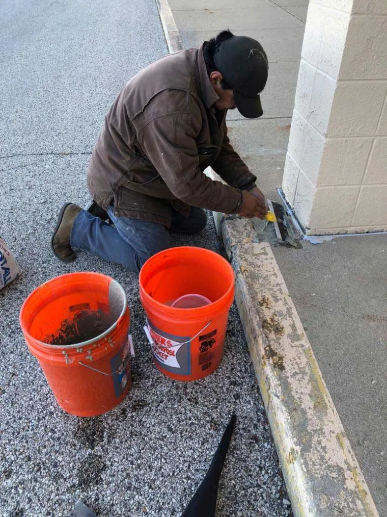 Apollo technician repairing a commercial sidewalk