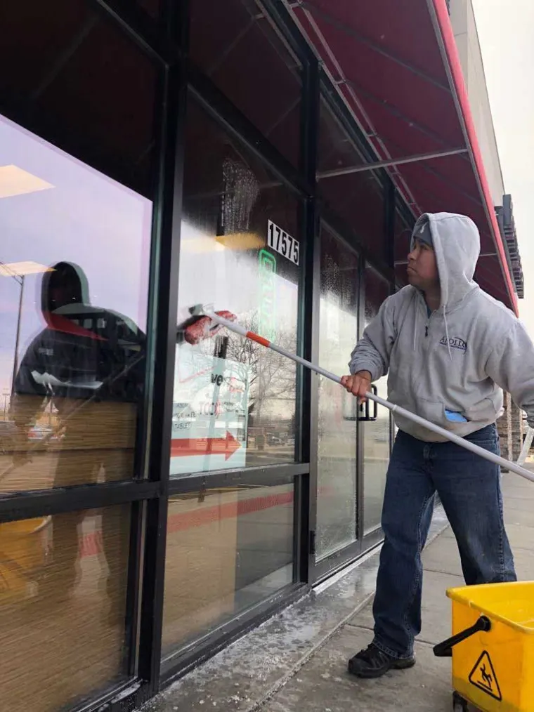 Storefront window cleaning during a day portering visit